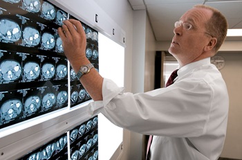 Doctor reviewing scans